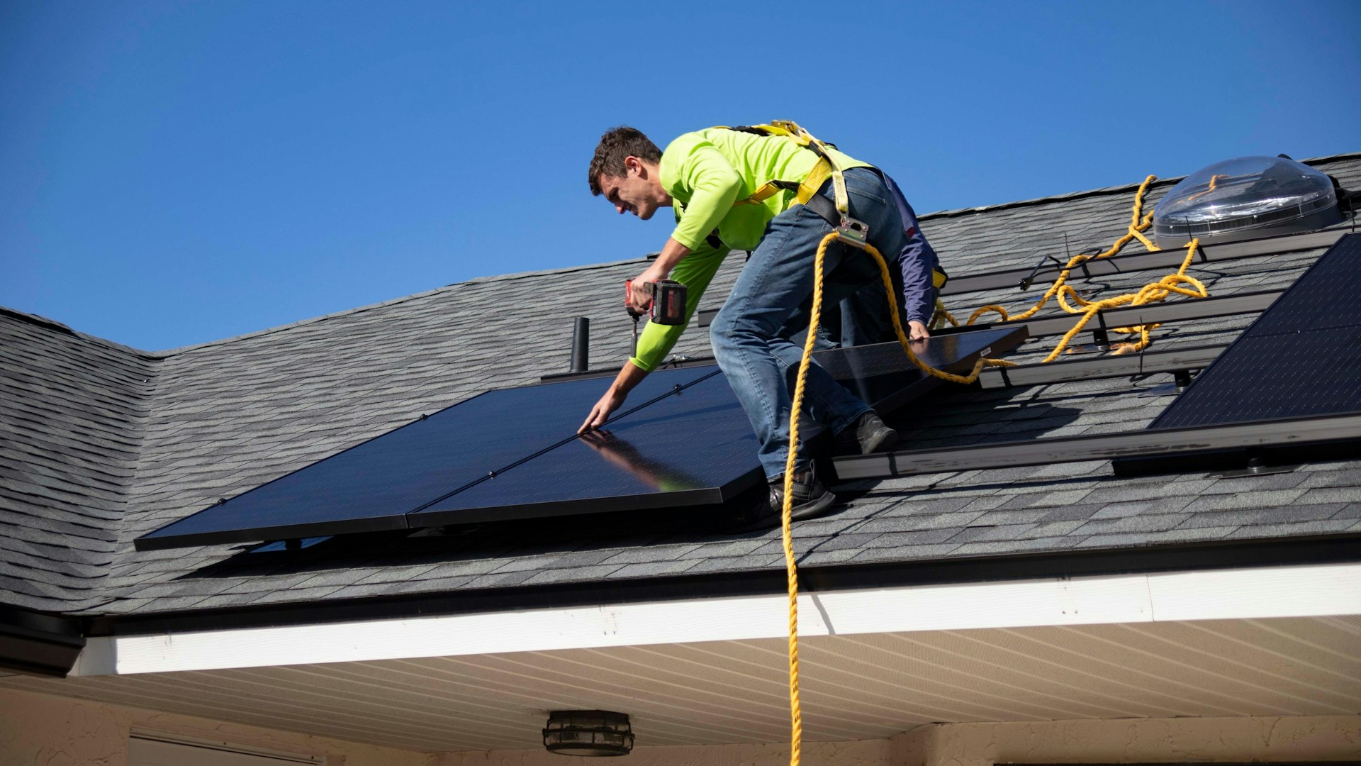 HVAC technician working on a rooftop unit
